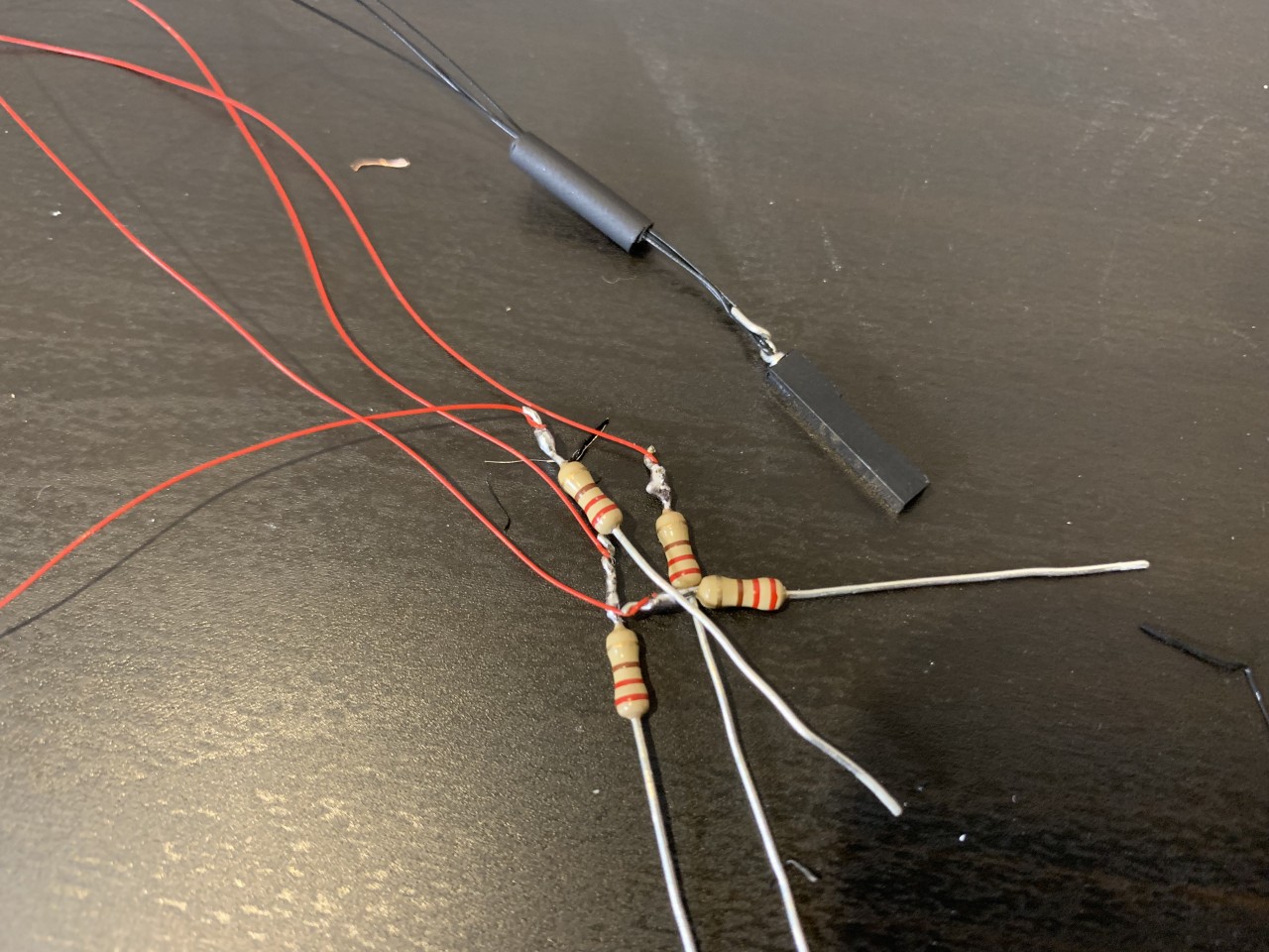 Connect each LED to a resistor, and tie all negative lines to ground